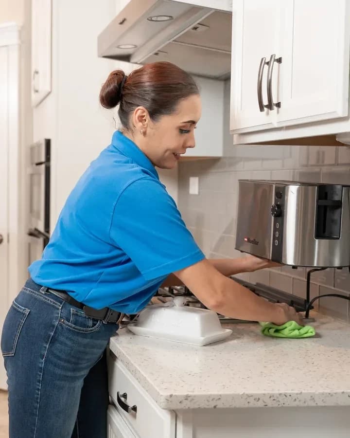 Cleaner mopping the floor of a commercial space after hours