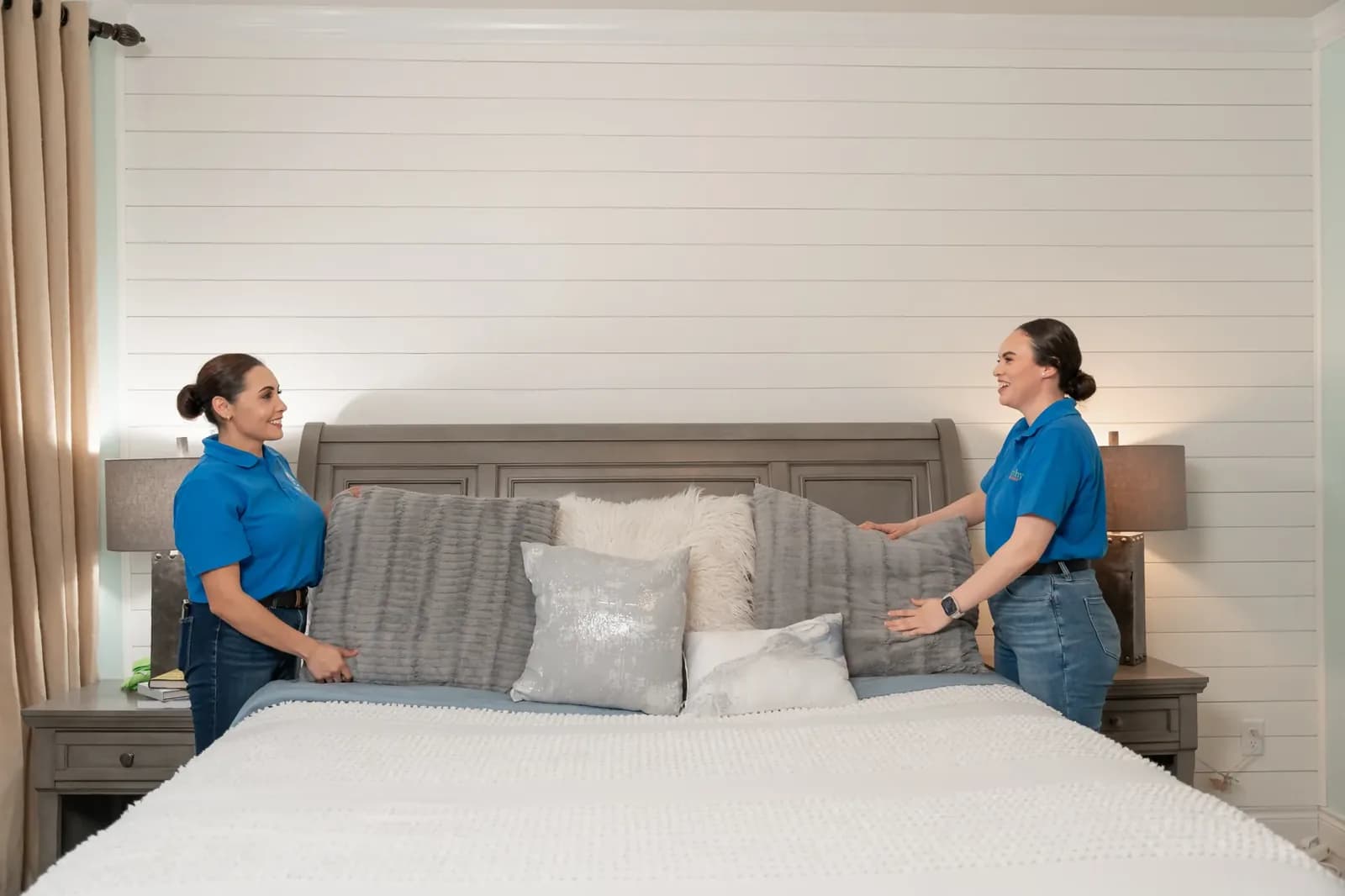 A Trustworthy cleaner making a bed during a recurring house cleaning in Austin, TX
