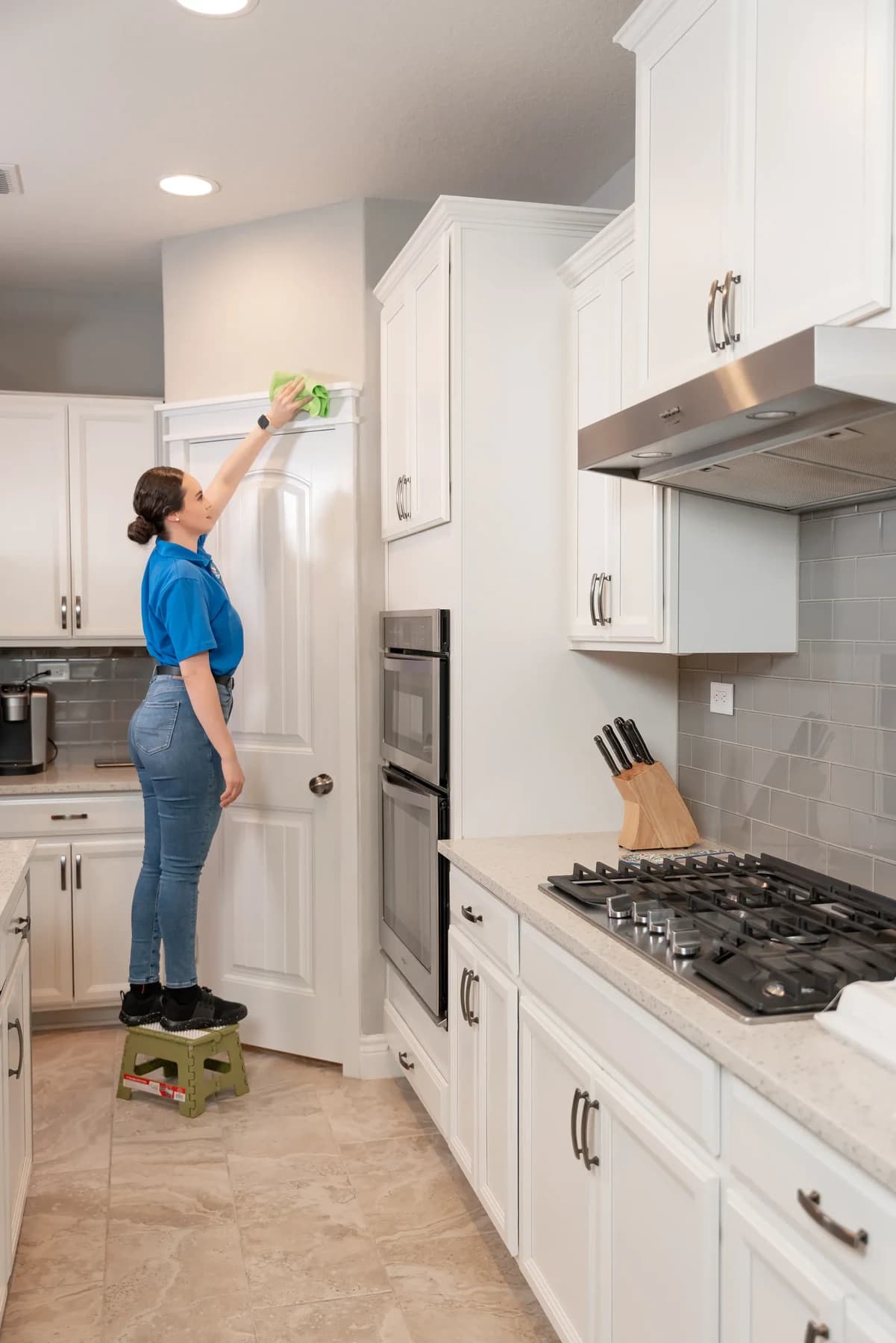 Two-person cleaning team working through an Austin kitchen