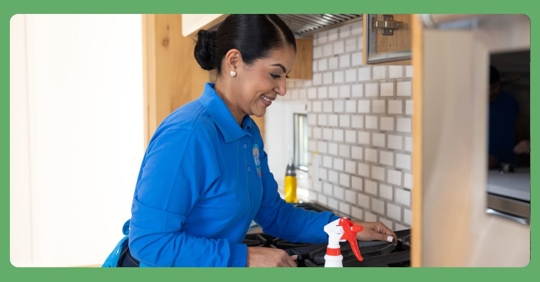 woman deep cleaning oven