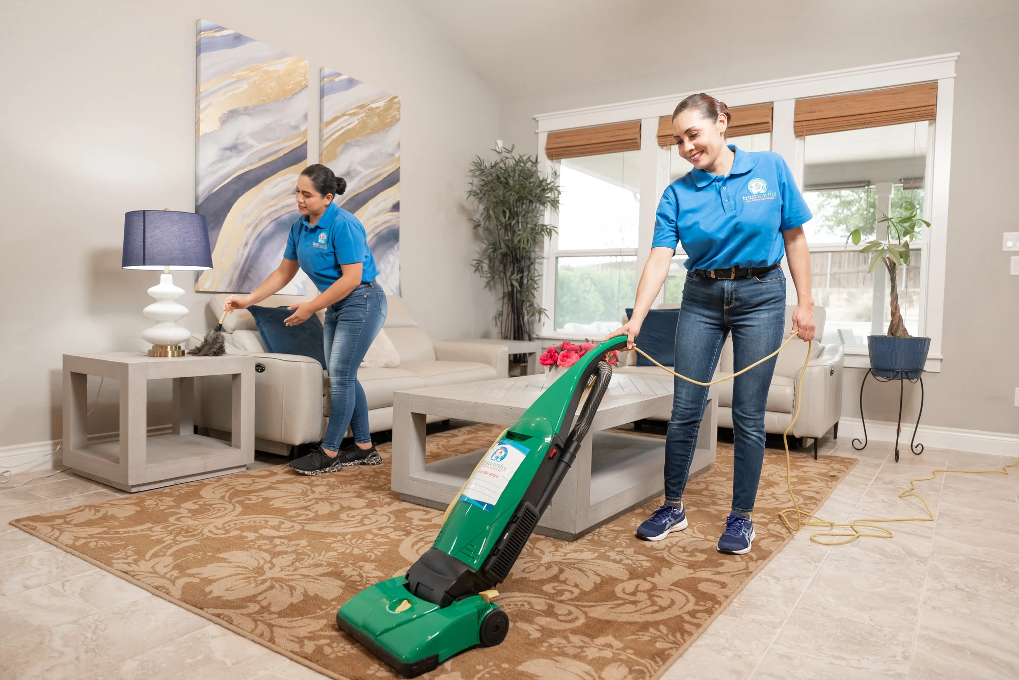 Trustworthy cleaning team vacuuming a living room in Austin, TX